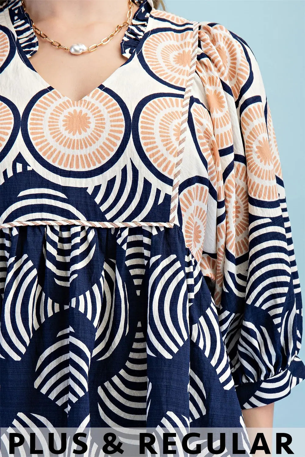Printed Babydoll Top with a Ruffled Neck by Gigio