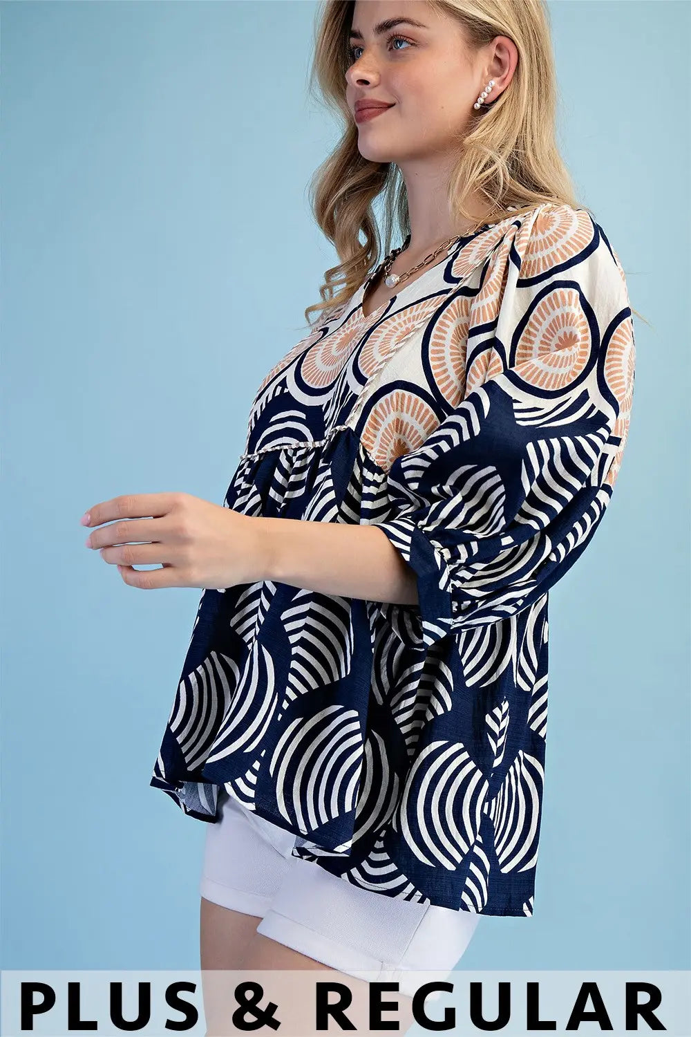 Printed Babydoll Top with a Ruffled Neck by Gigio