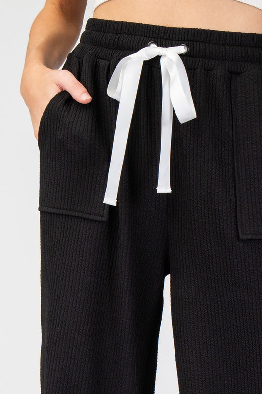 Textured Ribbon Straight Leg Pants in Black by ee:some