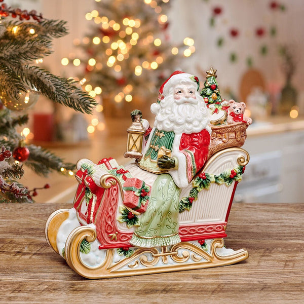 Red Santa Cookie Jar from 8 Oak Lane, featuring Santa in a sleigh with gifts, a tree, and a lantern. Ceramic holiday decor.