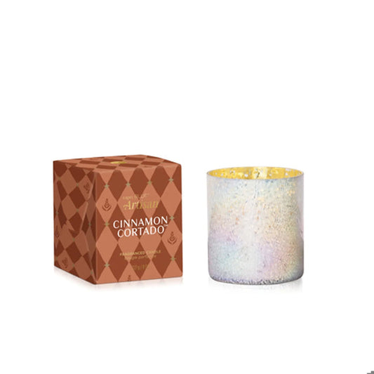 Capri Blue Cinnamon Cortado Winter Bazaar Candle in iridescent glass holder next to its brown patterned box.
