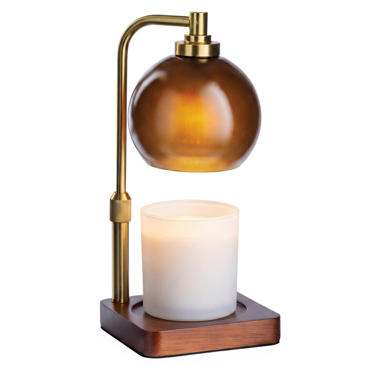 Amber Sphere Lamp by Candle Warmers Etc. with a brass arm and wooden base, warming a white candle.
