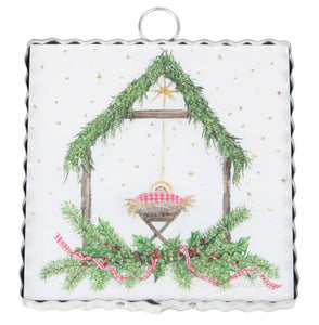 The Round Top Collection Mini Gallery Gingham King ornament: Nativity scene, baby Jesus in manger, green garland, red gingham.